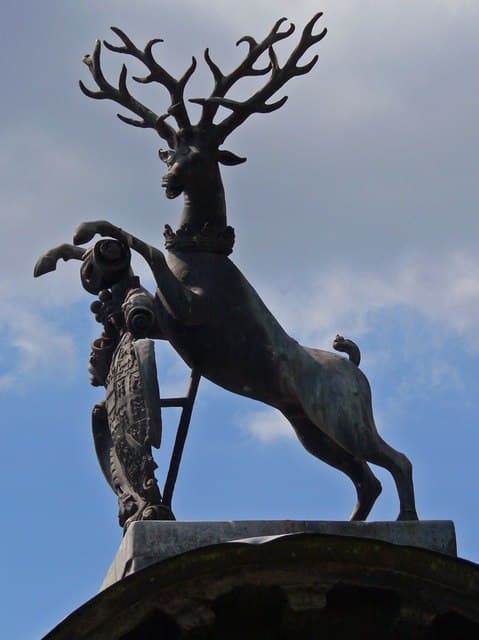 Golden Deer Figurine with Glass Sphere